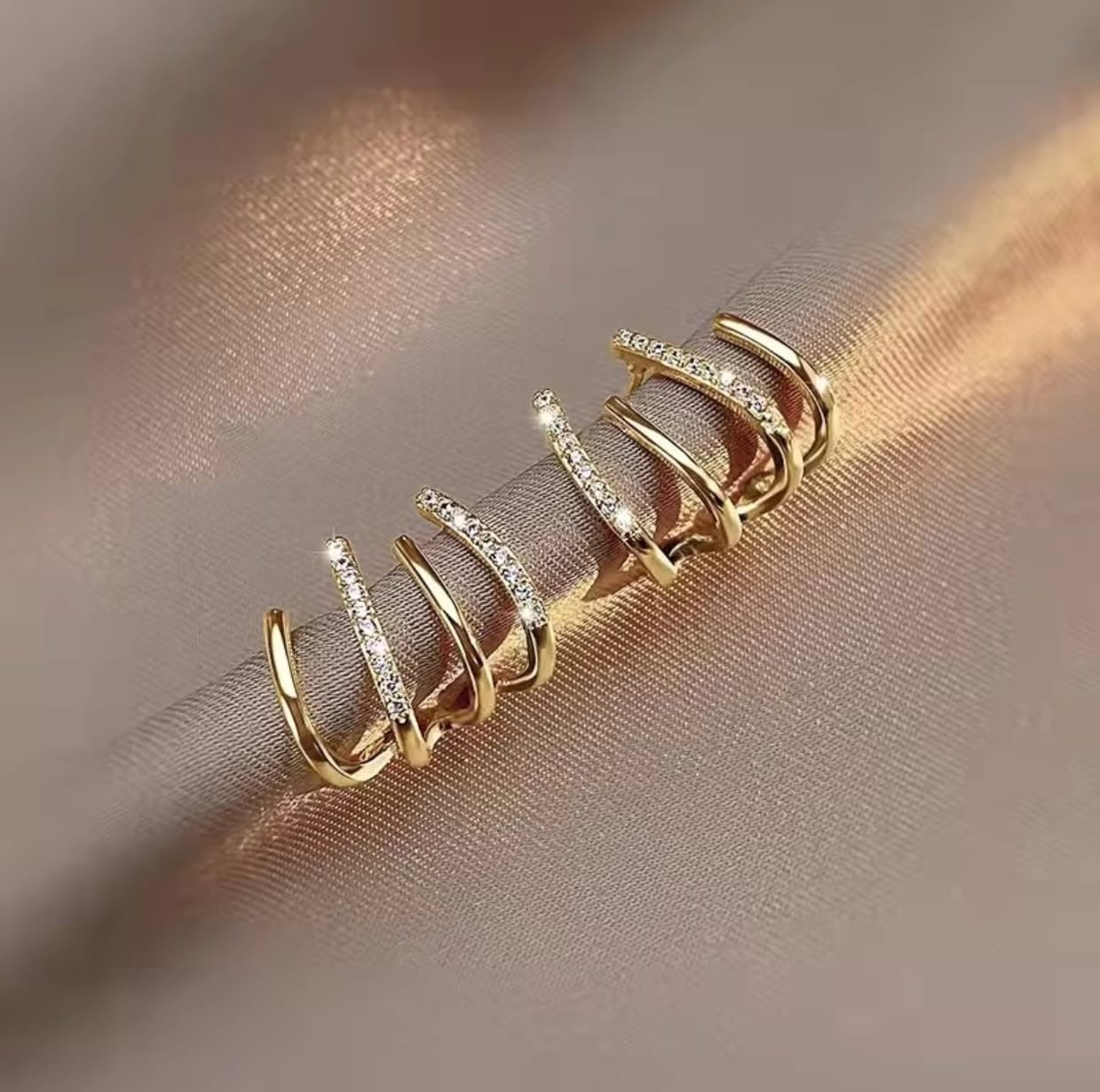Multi-layered claw hoop earrings
