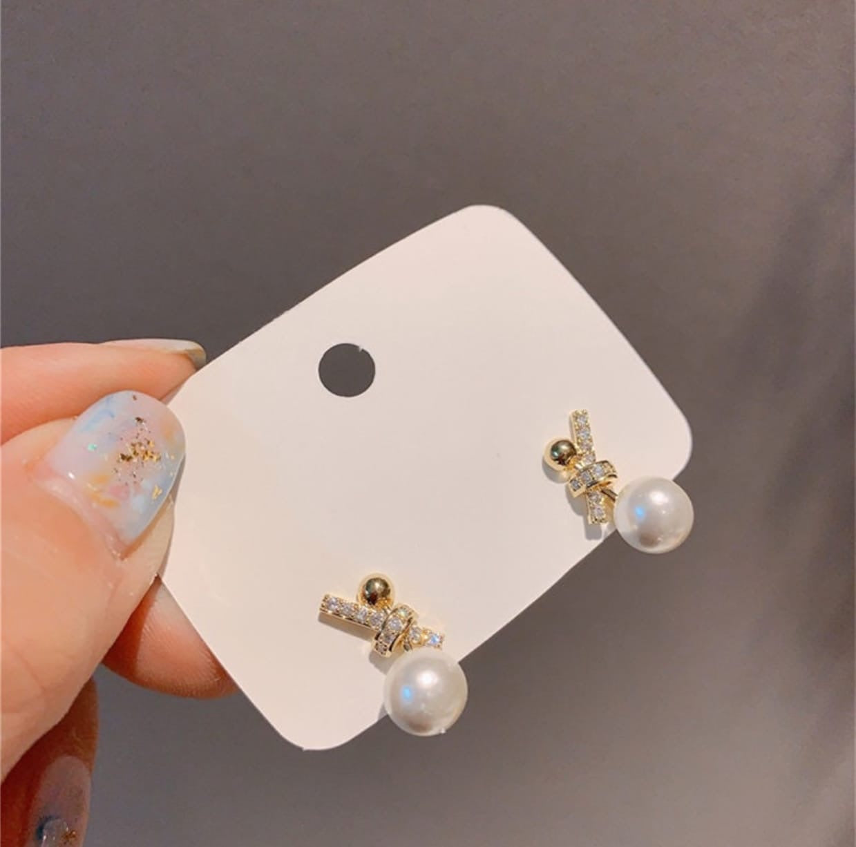 Knot pearl drop earrings