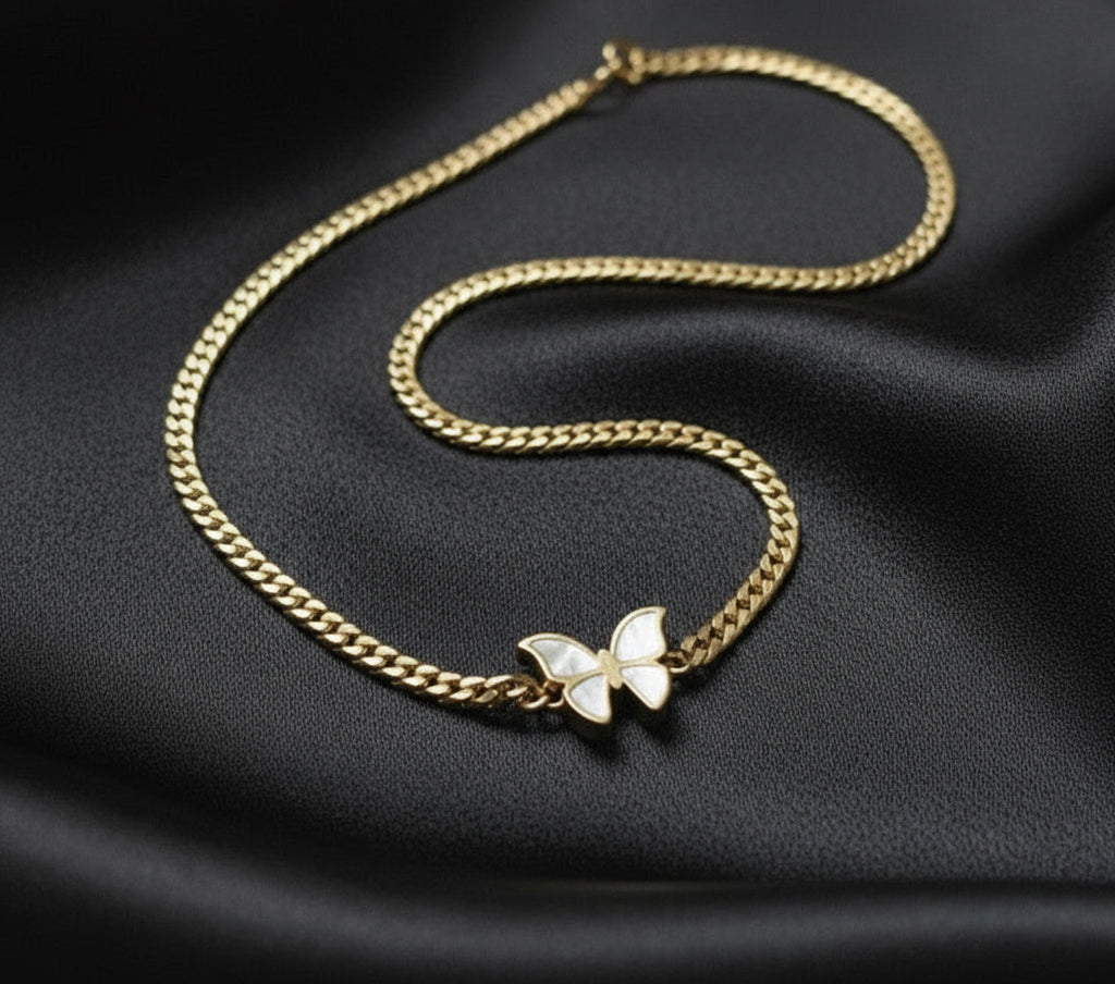 The central feature is a butterfly charm