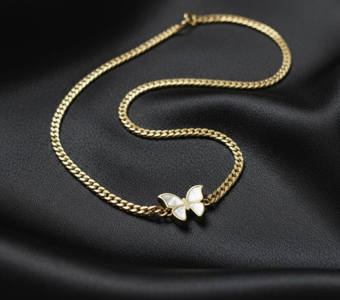 The central feature is a butterfly charm