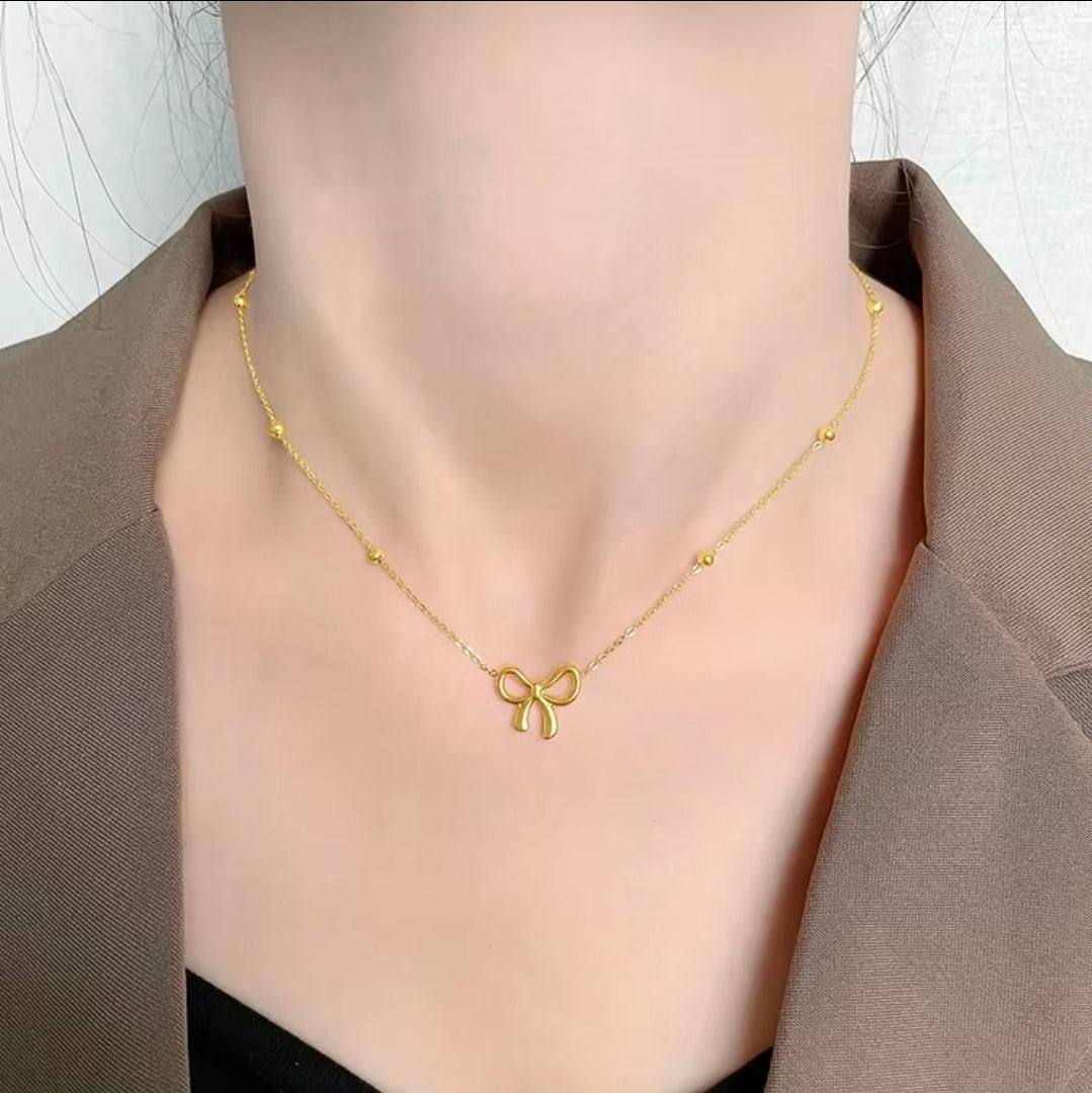 Golden Bow Bead Necklace