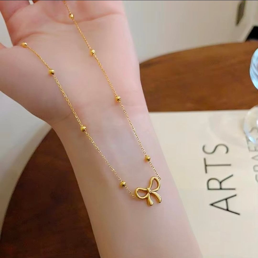 Golden Bow Bead Necklace