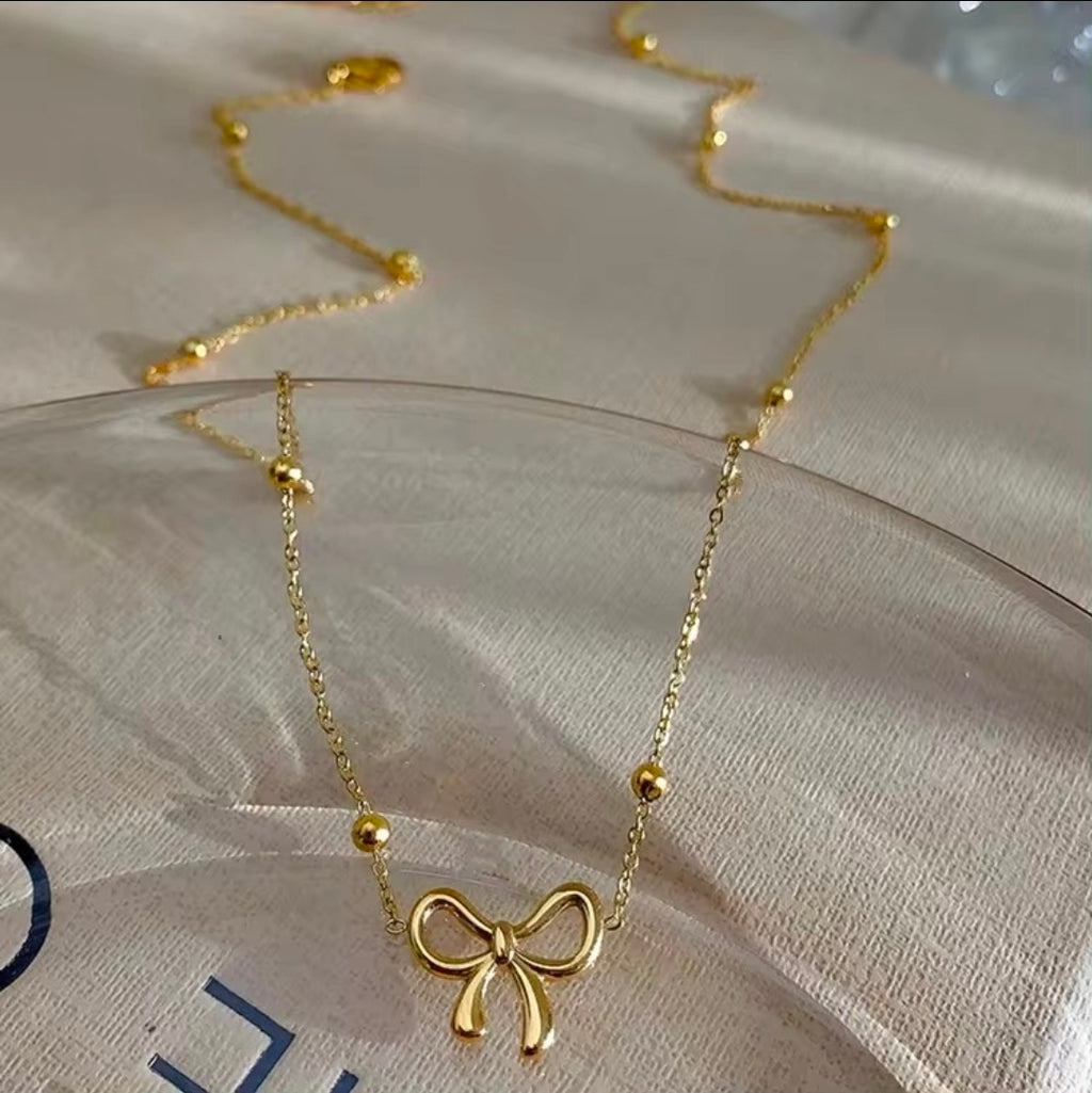 Golden Bow Bead Necklace