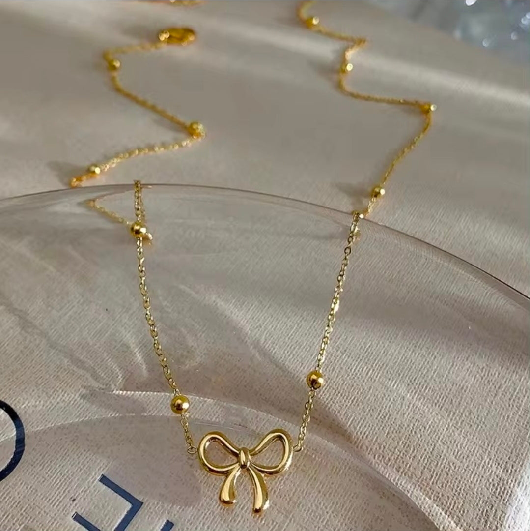 Golden Bow Bead Necklace
