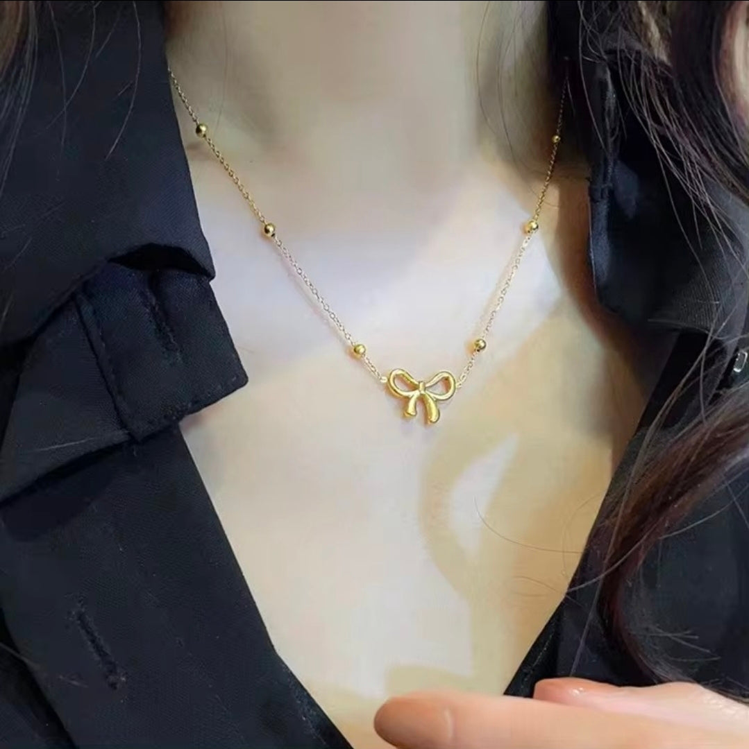 Golden Bow Bead Necklace